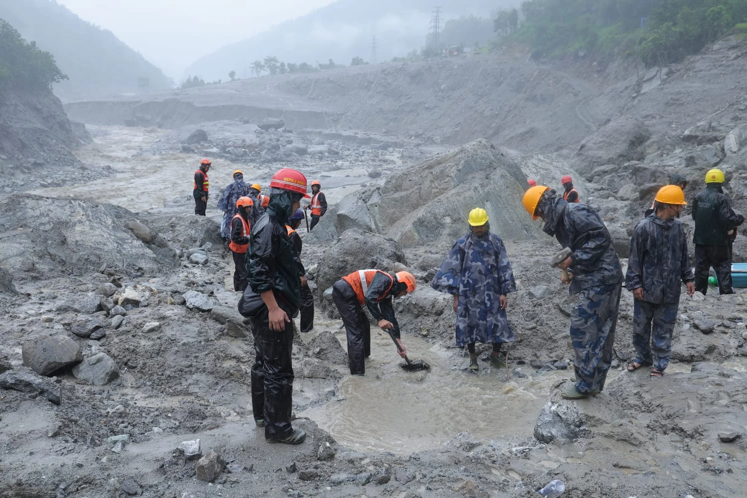 Rescue teams clearing flood debris near the Trishuli 3A hydropower tunnel in Nepal