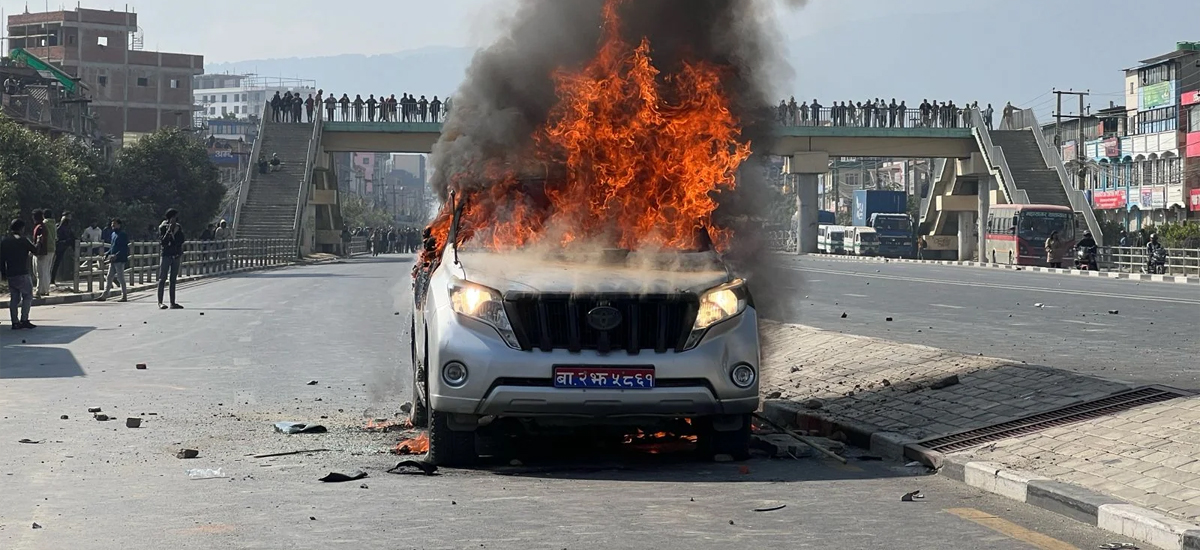 EPS exam centric demonstrators set Minister Prakash Jwala's vehicle on fire in Balkumari (Photos)
