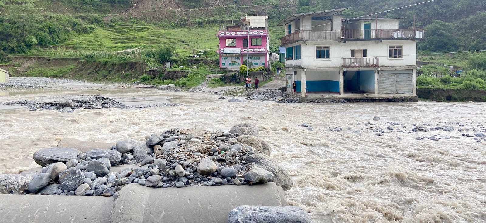Flood-fed Melamchi sweeps away a temporary bridge
