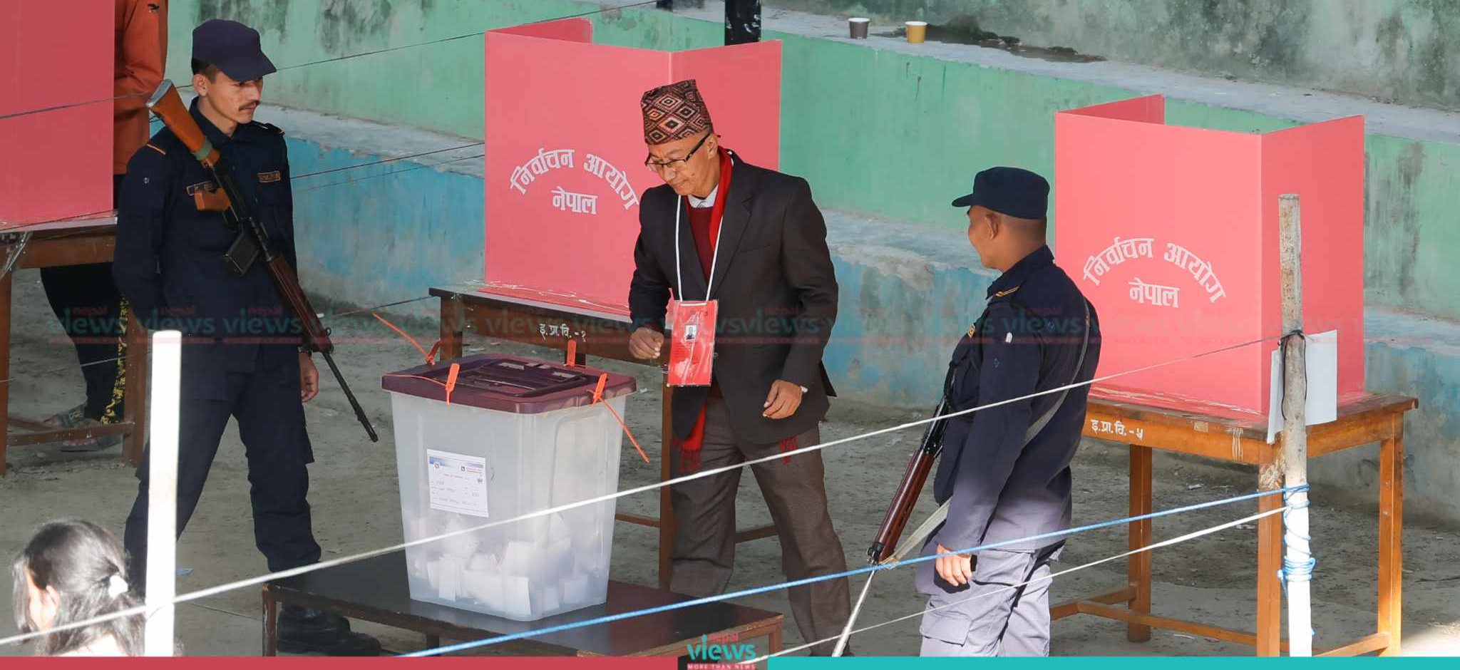Nepali Congress's Dangol, candidate of Kirtipur’s Mayor, casts vote (Photo Feature)